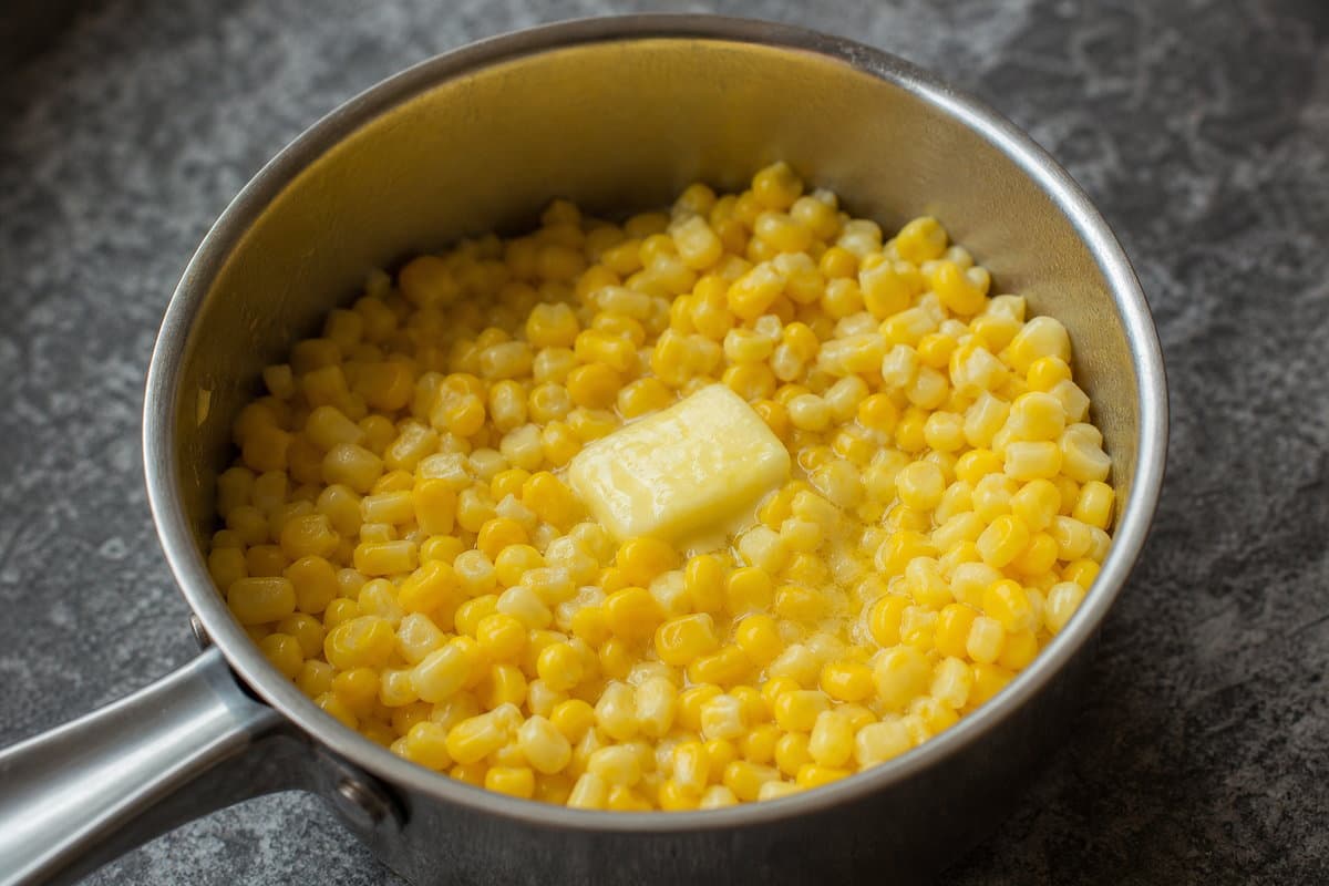 Butter the corn