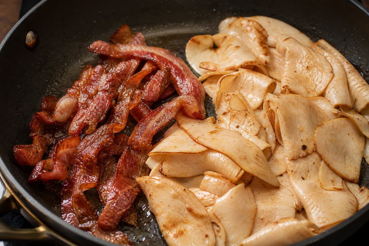 Cook the bacon, warm the turkey